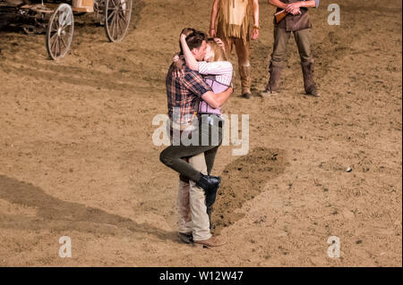 Hamburg, Germany. 29th June, 2019. The actors Raul Richter as Martin Baumann, the son of the bear hunter, and Larissa Marolt as Tiffany O Toole perform in the open-air theatre at Kalkberg during the premiere of the play of the Karl May play 'Unter Geiern - Der Sohn des Bärenjägers' (Under Vultures - The Son of the Bear Hunter). The play premiered in the evening. Credit: Daniel Bockwoldt/dpa/Alamy Live News Stock Photo