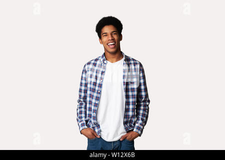 Afro Teenage Guy Posing with Hands in Pockets Stock Photo