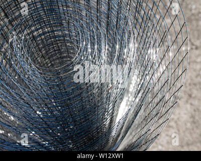 Roll loose shiny thin steel wire grating Stock Photo