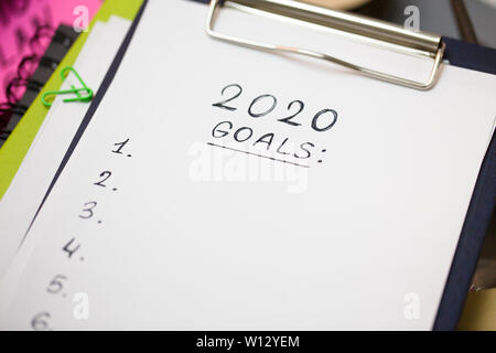 Close up of clipboard with black handwriting text on white Stock Photo