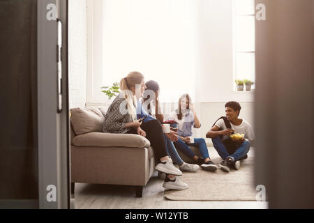 Young friends talking and spending time together Stock Photo