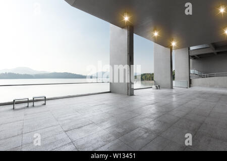 empty marble floor with beautiful lake in blue sky Stock Photo
