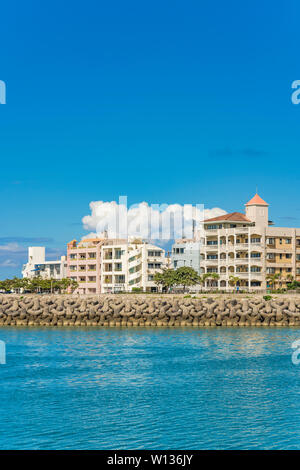 Condominium Chatanmonogatari Bayside and Harbor park in the vicinity of the American Village in Chatan City of Okinawa. Stock Photo