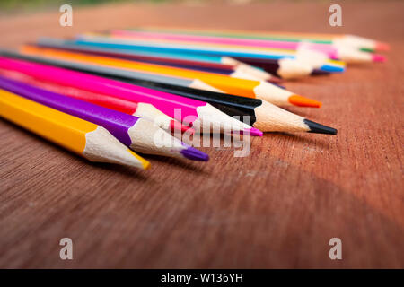 A neatly arranged colored pencil on the table. Stock Photo
