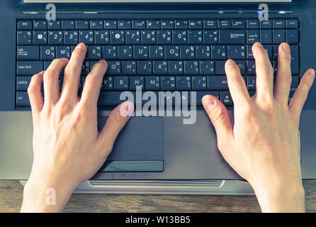 Hand caucasian man put on notebook typing on english-thai Stock Photo