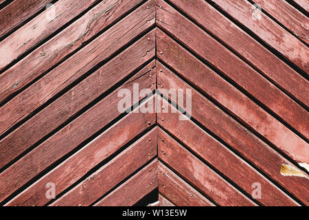 Red, old wooden doors with peeling paint, abstract background of planks Stock Photo