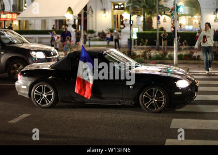 People in the streets of Nice with tricolour flags after France beat Belgium in FIFA World Cup semi-finals 10.7.2018 Stock Photo