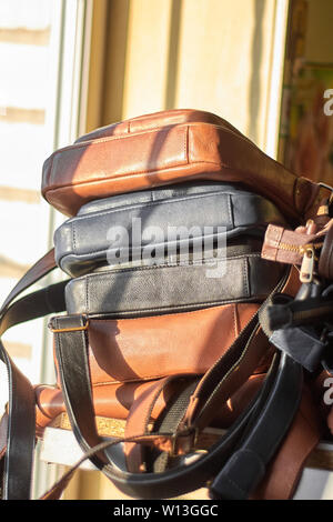 Leather bags in the crafting store. Leather craft. Custom accessories Stock Photo