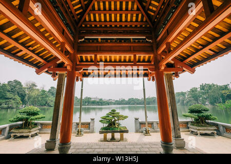 Beautiful example of traditional Asian architecture. Garden an lake in front of Asian house Stock Photo