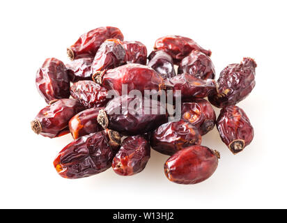 Heap of dried dog rose berries isolated on white background Stock Photo
