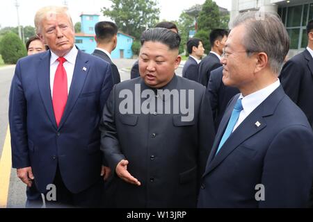 Panmunjom, Democratic People's Republic of Korea (DPRK). 30th June, 2019. Kim Jong Un (C), top leader of the Democratic People's Republic of Korea (DPRK), U.S. President Donald Trump (L) and South Korean President Moon Jae-in meet at the truce village of Panmunjom on June 30, 2019. Credit: NEWSIS/Xinhua/Alamy Live News Stock Photo