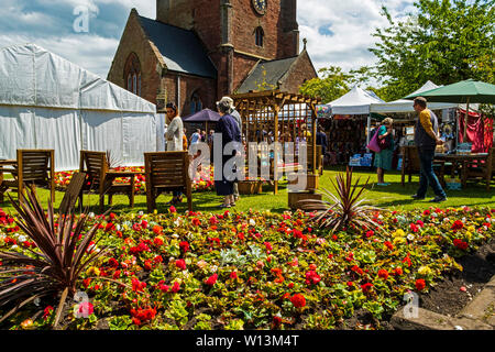 continental market in the grounds of st Nicholas church Whitehaven west cumbria england Stock Photo