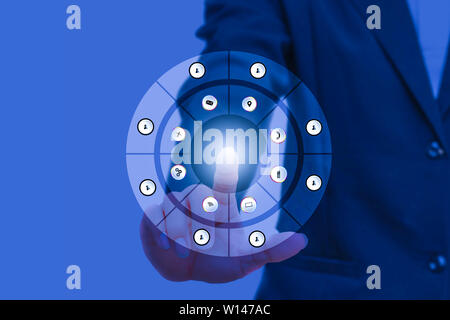 businessman pressing modern social buttons on social network interface with finger hand touch technology icon on blue background and copy space add te Stock Photo