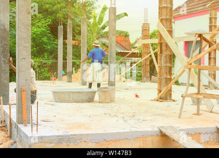 construction workers collaborating in the installation formwork workplace build a house Stock Photo