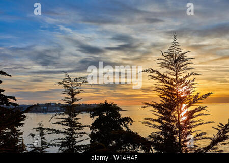 Image of the sunset at Saint Malo looking out to sea with Dinard in the background. Stock Photo