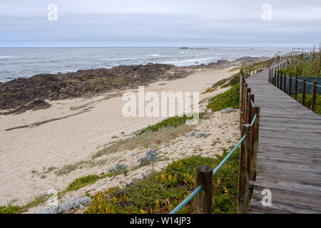 Vila Chã, Portugal - June 23, 2019 : Wooden walkway along the coast in northern Portugal, Vila do Conde, Portugal Stock Photo