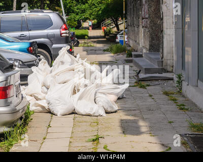 White construction garbage bags. Construction garbage bags piled on top of  one another. A large pile of construction garbage bags. abstract background  Stock Photo - Alamy