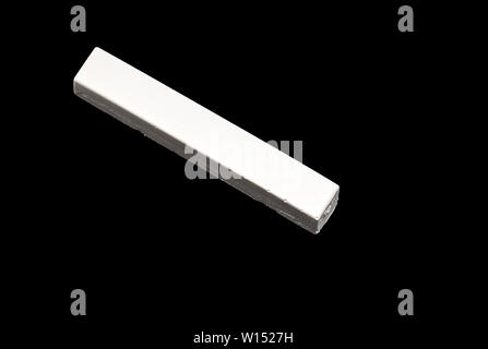 White Chalk isolated on Black Background Stock Photo