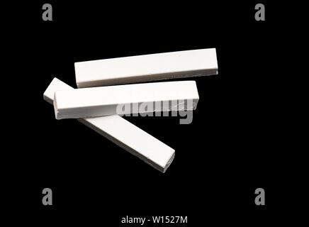 White Chalk isolated on Black Background Stock Photo