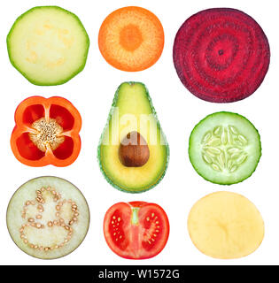 Isolated vegetable slices. Collection of fresh cut vegetables (zucchini, carrot, beetroot, bell pepper, avocado, cucumber, eggplant, tomato, potato) i Stock Photo