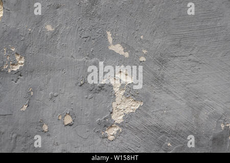 Peeling grey wall, detail of an abandoned and crumbling wall Stock Photo