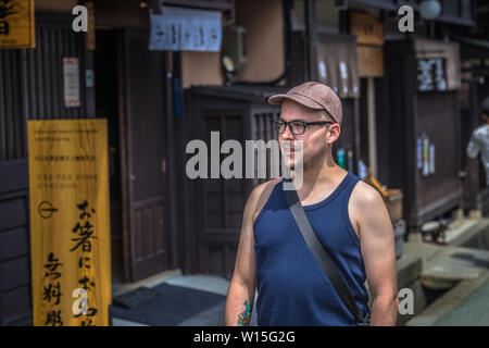 Takayama - May 26, 2019: Western travelers in the streets of Takayama, Japan Stock Photo