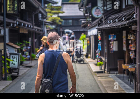 Takayama - May 26, 2019: Western travelers in the streets of Takayama, Japan Stock Photo