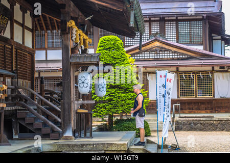 Takayama - May 26, 2019: Western traveler in a shrine in Takayama, Japan Stock Photo