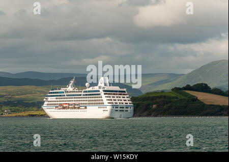 Bantry, West Cork, Ireland. 30th June, 2019. For the second time in a week, the cruise liner 'Nautica' spent the day anchored in Bantry Harbour.  She is pictured setting sail for Galway, where she will arrive on Monday morning. Credit: Andy Gibson/Alamy Live News. Stock Photo