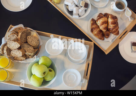 Top view of continental breakfast served in a hotel room. Stock Photo