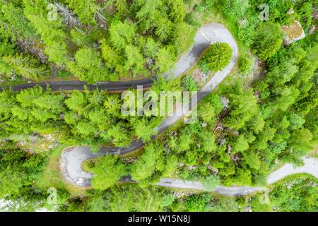 Amazing aerial view of windy road in a mountain valley, Switzerland Stock Photo