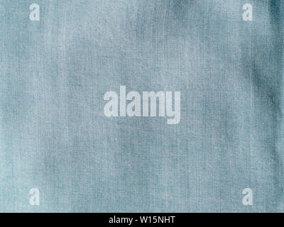Modern soft jeans blouse texture close up. Lyocell or tencel pattern - modern natural cellulose fabric blue denim color. Can use for design or text. Copy space Stock Photo