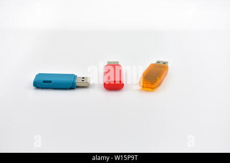 USB flash memory drives with colours on a white background. Stock Photo