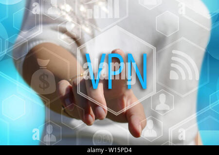 The businessman chooses  button VPN,  Virtual Private Network on the touch screen Stock Photo