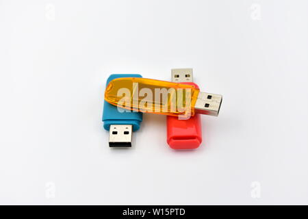 USB flash memory drives with colours on a white background. Stock Photo