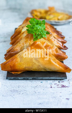 Chicken samosas with almond and apricot - asian snack idea Stock Photo