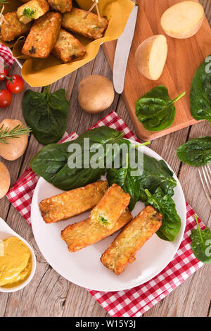 Potato croquettes with spinach and mozzarella. Stock Photo