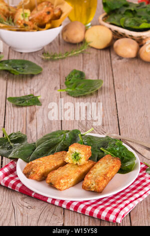 Potato croquettes with spinach and mozzarella. Stock Photo