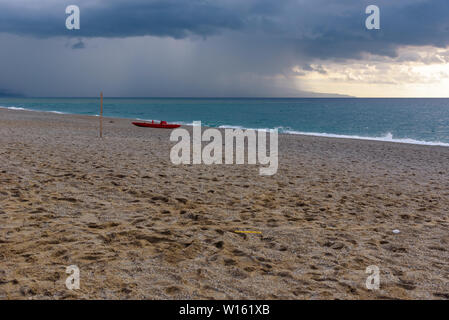 Dark clouds over the calabrian beach before the storm Stock Photo