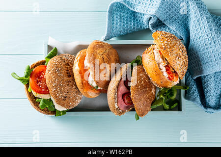 Assorted sandwiches in wooden box Stock Photo