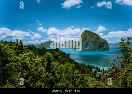 Panoramic aerial view of tropical shoreline on Palawan with epic Pinagbuyutan island on horizon. El Nido-Philippines. Best natural wonder in Southeast Stock Photo