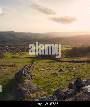 A low sunset over one of the many broken stone walls in the Peak District National Park Stock Photo