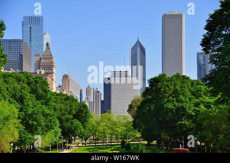 Chicago, Illinois, USA. A portion of the city skyline rises above the venerable facades of buildings along Michigan Avenue. Stock Photo