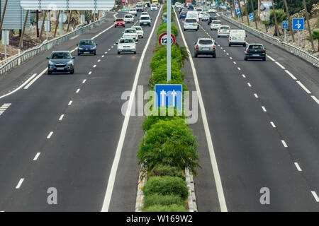 City traffic. The route for the movement of cars, highway, visew from a height. Cars Drive at high speed. Stock Photo