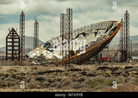 Huge parabolic Dish with Solar Panels. Abandoned construction for producing enegy. Used for production of methanol and coal.. El Medano, Tenerife, Can Stock Photo