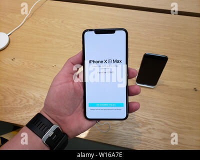 MONTREAL, CANADA - JUNE 20, 2019: Apple iPhone XS Max in a hand at Apple store. Apple Inc. is an American multinational technology company headquarter Stock Photo