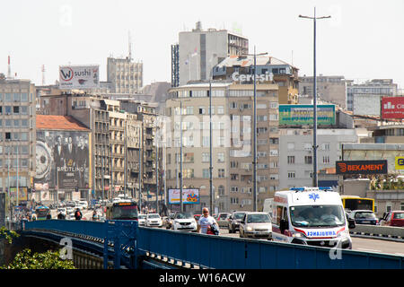 Belgrade, Serbia - April 25, 2019: Traffic at Branko bridge with driving vehicles and pedestrians walking,with the view on the city Stock Photo