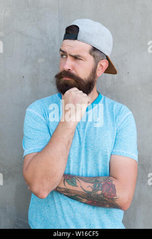 Premium Photo  Portrait of a tattooed handsome middleaged man with beard  and hairstyle dressed in a blue shirt and tie pose in a studio with  crossed arms isolated on a textured