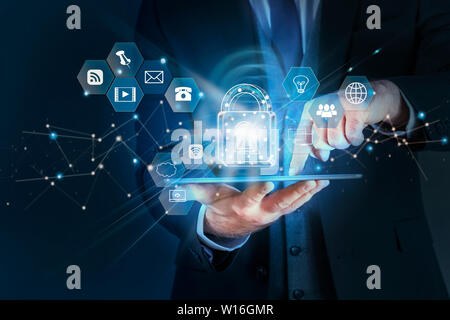 Business man protecting data personal information on tablet, Data protection privacy concept, Technology cyber Security concept. Businessman working i Stock Photo