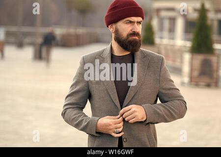 Stylish modern outfit hat bright accessory. Hipster outfit. Stylish casual  outfit for fall and winter season. Menswear and male fashion concept. Man  bearded hipster stylish fashionable coat and hat Stock Photo 